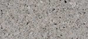 A countertop material sample named Pearl Gray, available in Bangalore, featuring a light gray finish with a polished surface for contemporary designs.